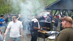 People grilling food